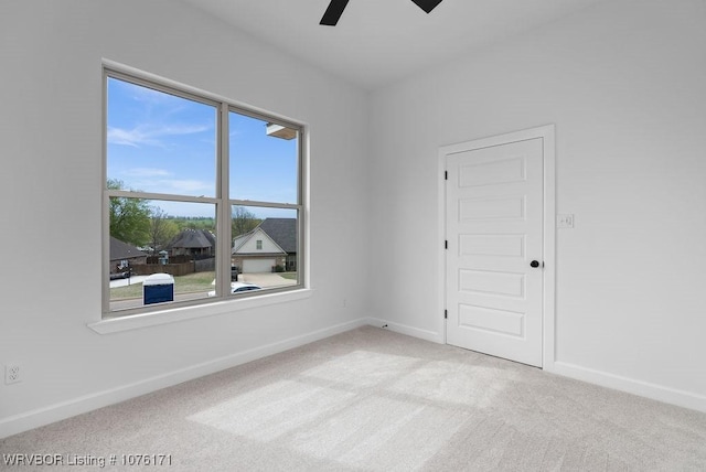 carpeted empty room with ceiling fan