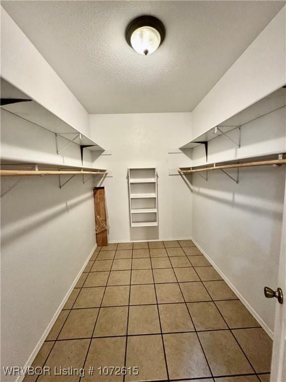 walk in closet featuring tile patterned floors