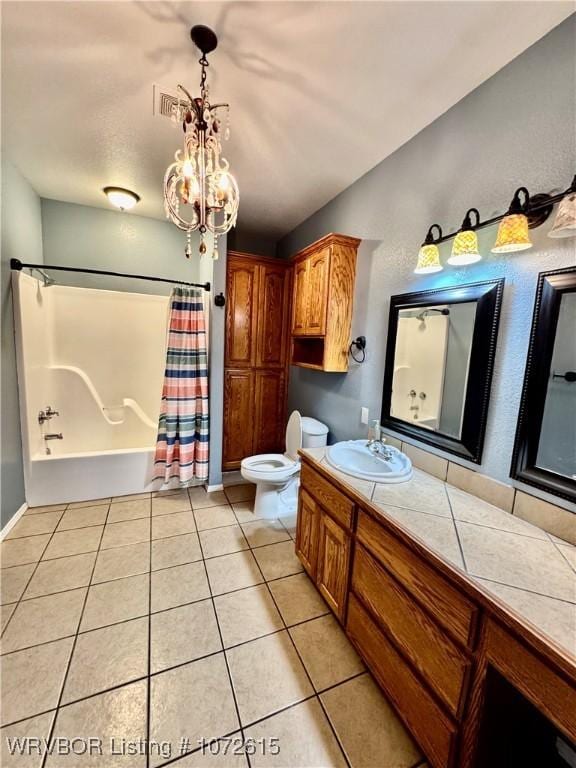 full bathroom featuring tile patterned flooring, a notable chandelier, shower / bath combination with curtain, toilet, and vanity