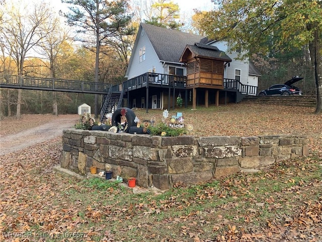 back of house with a wooden deck