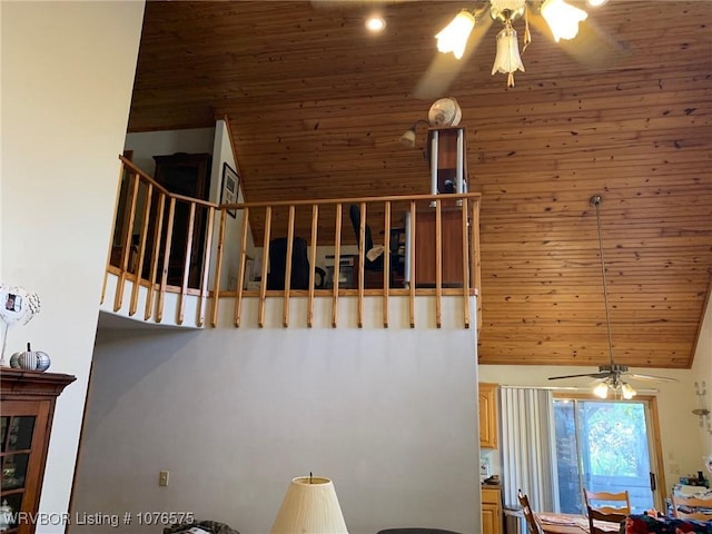 staircase with ceiling fan, wood ceiling, and vaulted ceiling