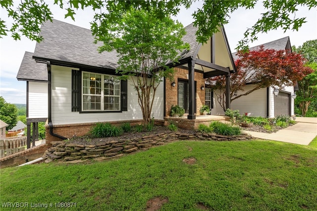 view of front of house with brick siding and a shingled roof