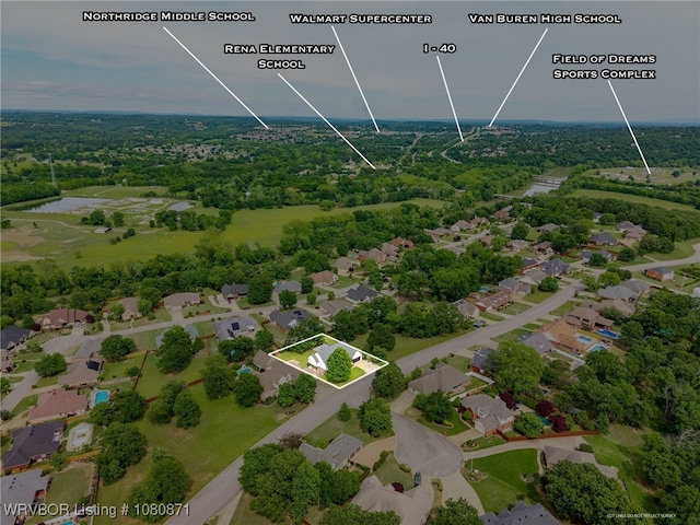 aerial perspective of suburban area featuring property boundaries highlighted and a large body of water