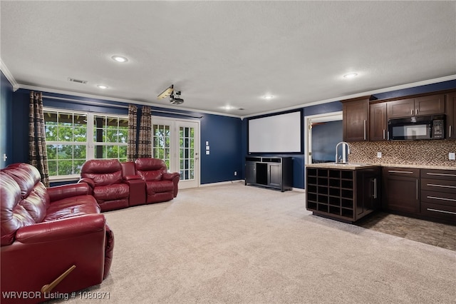 living room featuring crown molding, light carpet, recessed lighting, and baseboards