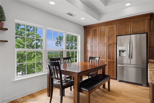 dining space featuring healthy amount of natural light, light wood-style floors, recessed lighting, and baseboards