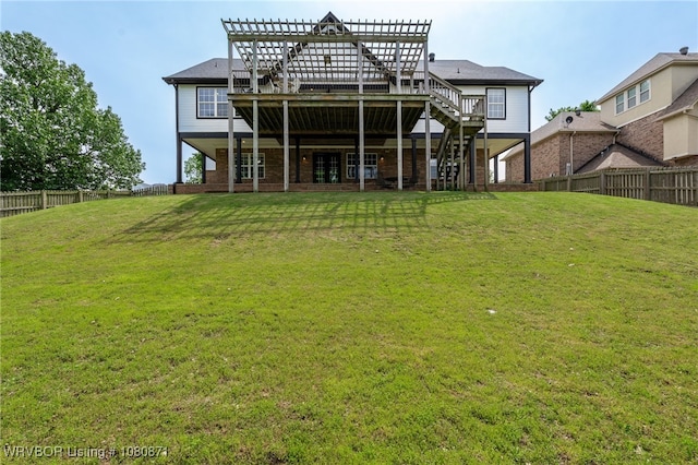 rear view of property with a pergola, stairs, and a deck