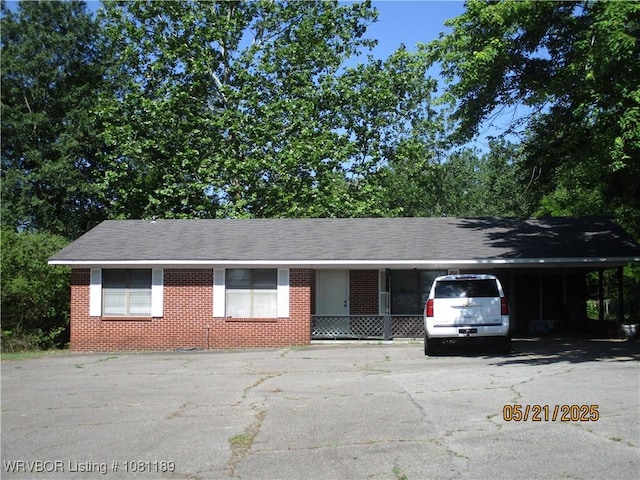 1501 18th St, Ozark, AR 72949 - ranch-style home with driveway and a carport