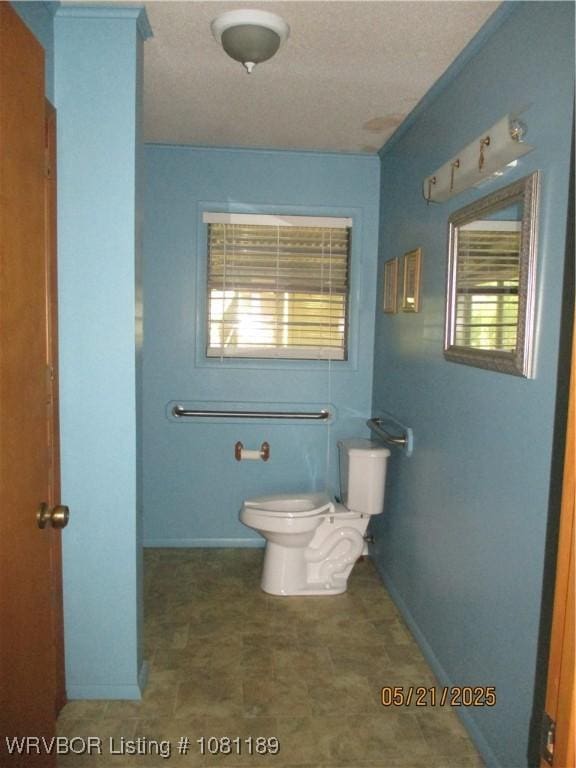 1501 18th St, Ozark, AR 72949 - bathroom with toilet and baseboards