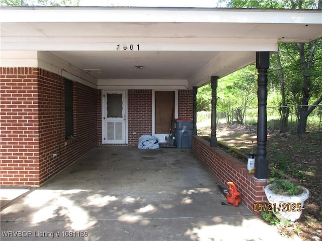 1501 18th St, Ozark, AR 72949 - view of patio featuring an attached carport