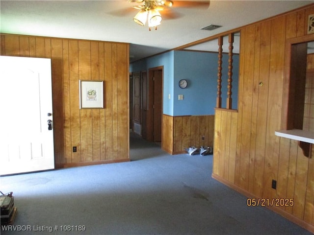 1501 18th St, Ozark, AR 72949 - unfurnished room featuring wood walls, carpet flooring, and ceiling fan