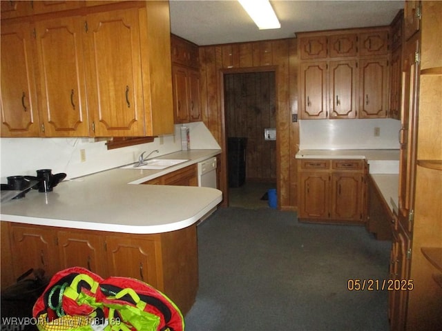 1501 18th St, Ozark, AR 72949 - kitchen featuring a sink, brown cabinetry, a peninsula, and light countertops