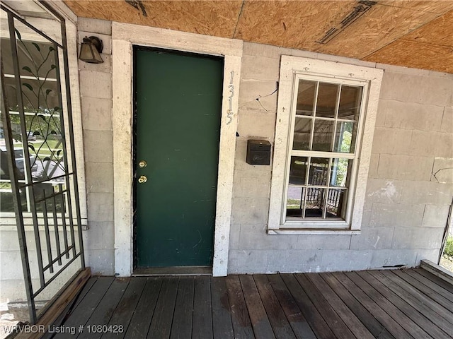 entrance to property with concrete block siding