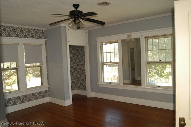 unfurnished room with dark hardwood / wood-style floors, ceiling fan, and crown molding