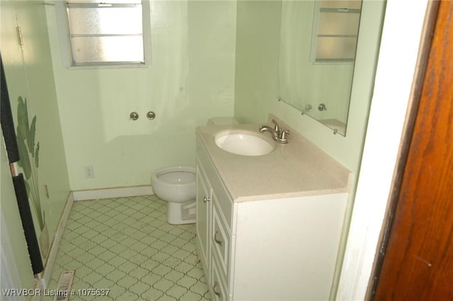 bathroom with vanity and toilet