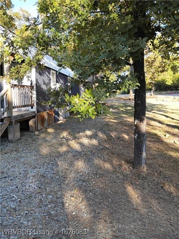 view of yard featuring a wooden deck