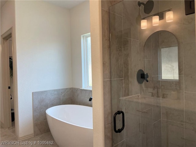 9121 Wayne Xing, Fort Smith, AR 72916 - bathroom featuring a shower stall, a freestanding tub, and tile patterned flooring
