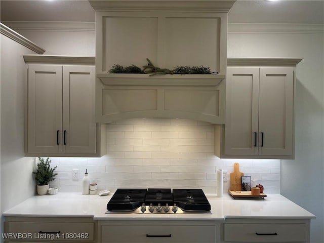 9121 Wayne Xing, Fort Smith, AR 72916 - kitchen with stainless steel gas cooktop, crown molding, tasteful backsplash, and light countertops