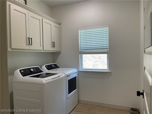 9121 Wayne Xing, Fort Smith, AR 72916 - laundry area with washer and clothes dryer, cabinet space, and light wood-style floors