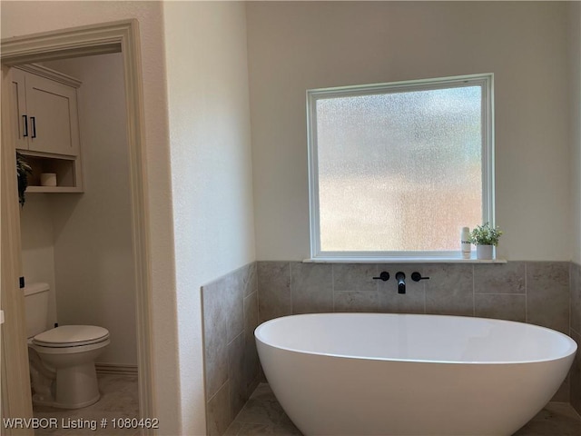 9121 Wayne Xing, Fort Smith, AR 72916 - full bath featuring a soaking tub, toilet, healthy amount of natural light, and tile walls