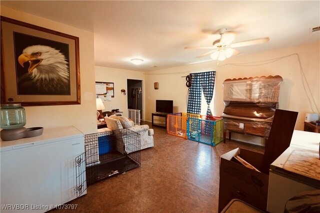 living room featuring ceiling fan