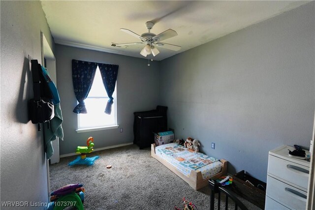 carpeted bedroom with ceiling fan