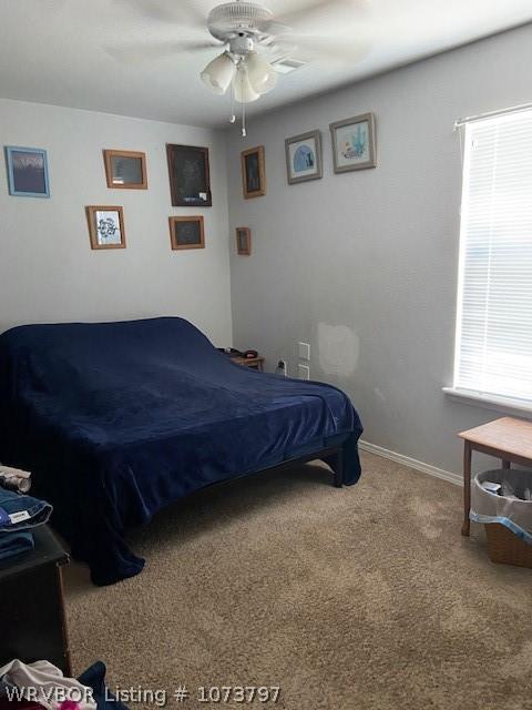 carpeted bedroom with ceiling fan