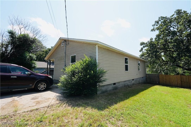 view of home's exterior with a lawn