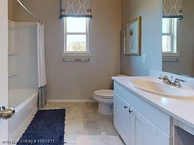8011 Windflower Ln, Fort Smith, AR 72916 - bathroom with vanity and shower / tub combo