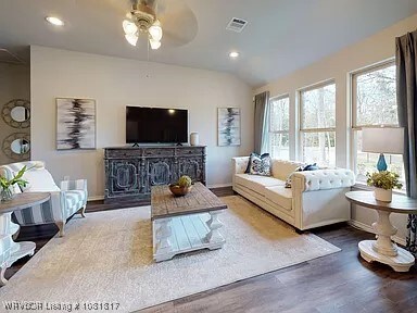 8011 Windflower Ln, Fort Smith, AR 72916 - living area featuring healthy amount of natural light, wood finished floors, a ceiling fan, recessed lighting, and vaulted ceiling