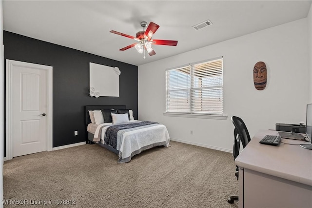 carpeted bedroom with ceiling fan