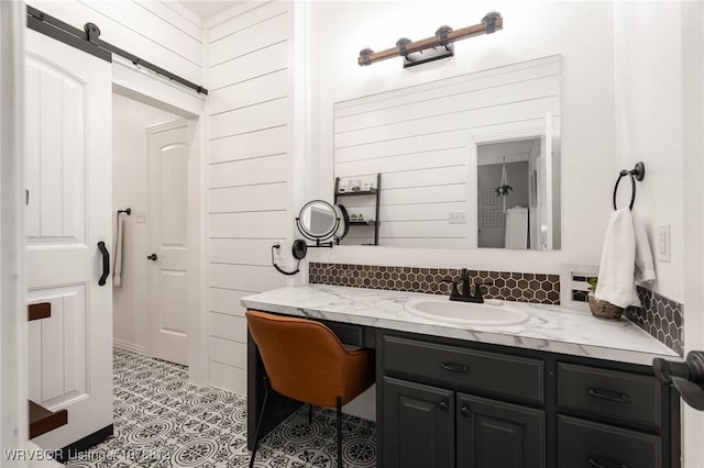 bathroom with tile patterned flooring and vanity