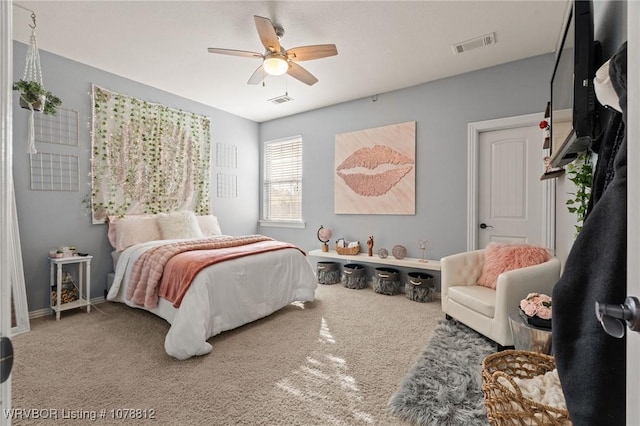 bedroom with ceiling fan and carpet