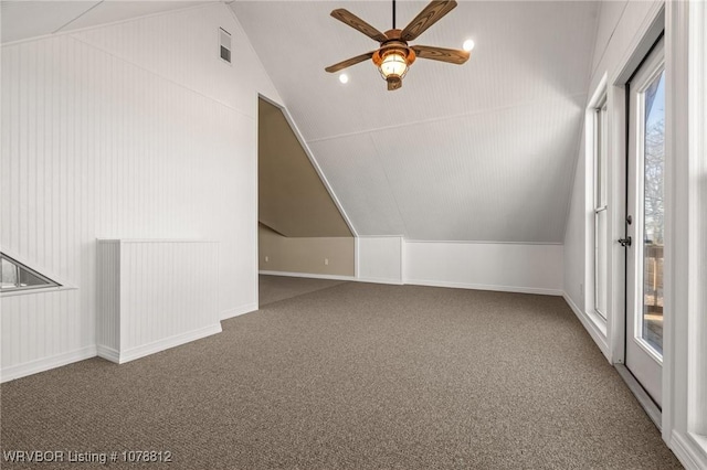 bonus room with lofted ceiling, carpet floors, and ceiling fan