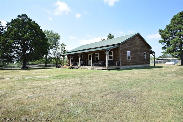 view of front of house featuring covered porch and a front lawn