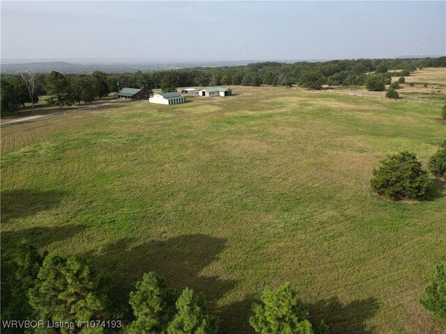 birds eye view of property with a rural view