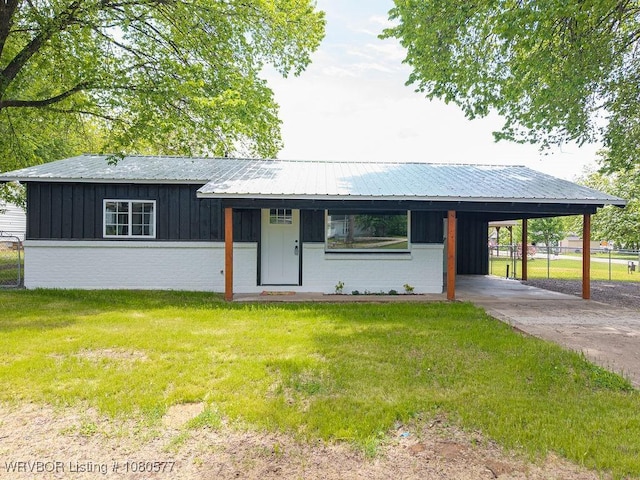 301 Choctaw St, Hackett, AR 72937 - ranch-style home featuring board and batten siding, brick siding, fence, a carport, and a front yard