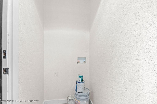 301 Choctaw St, Hackett, AR 72937 - laundry room featuring baseboards, hookup for a washing machine, laundry area, and a textured wall
