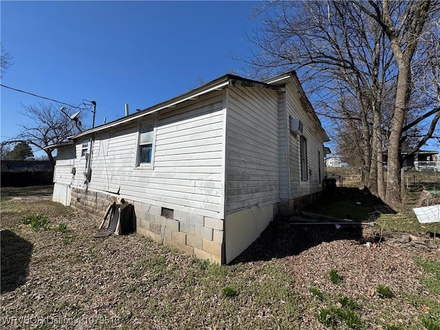 view of side of home featuring crawl space