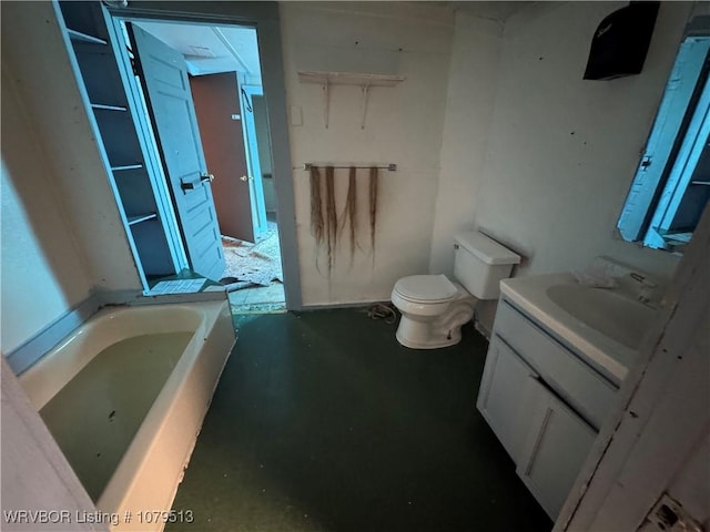 full bathroom with toilet, vanity, and a garden tub