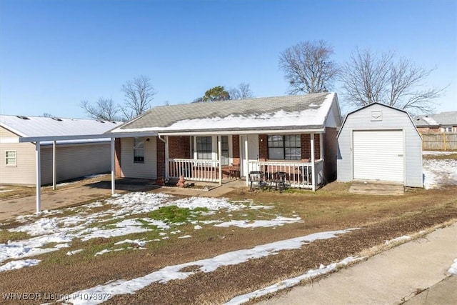 ranch-style home featuring a porch and a shed