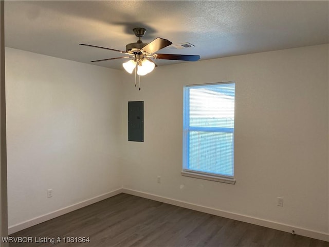 4223 High St, Fort Smith, AR 72904 - spare room featuring electric panel, dark wood-style flooring, ceiling fan, and a textured ceiling
