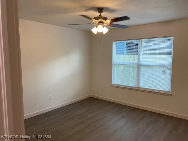 4223 High St, Fort Smith, AR 72904 - empty room featuring ceiling fan and dark wood finished floors