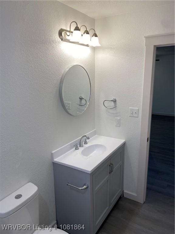 4223 High St, Fort Smith, AR 72904 - bathroom with vanity, wood finished floors, and a textured wall