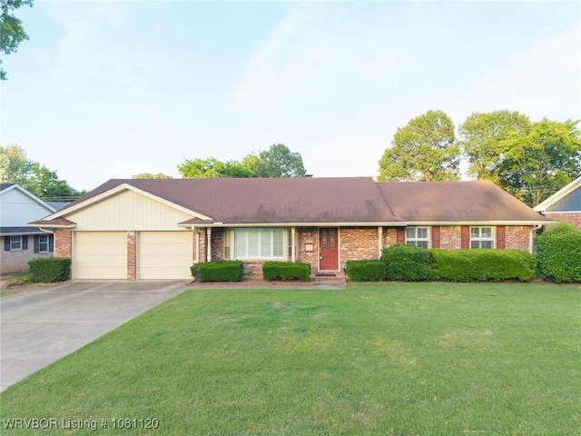 2017 S 70th St, Fort Smith, AR 72903 - ranch-style home featuring a garage, brick siding, concrete driveway, and a front lawn
