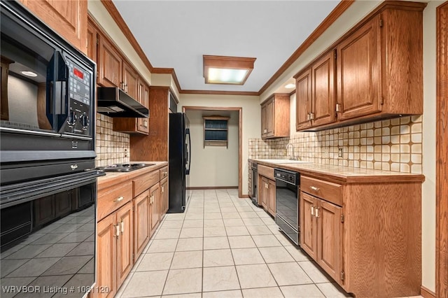 2017 S 70th St, Fort Smith, AR 72903 - kitchen featuring black appliances, under cabinet range hood, ornamental molding, light tile patterned floors, and tile counters