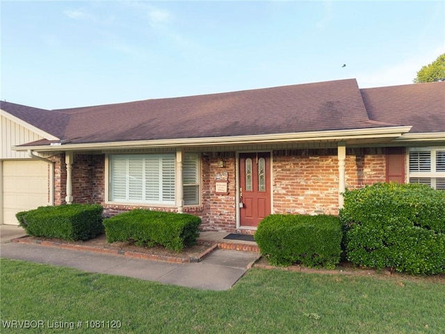 2017 S 70th St, Fort Smith, AR 72903 - ranch-style house with an attached garage, brick siding, a shingled roof, and board and batten siding
