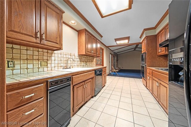 2017 S 70th St, Fort Smith, AR 72903 - kitchen with tile countertops, a sink, black appliances, vaulted ceiling, and under cabinet range hood