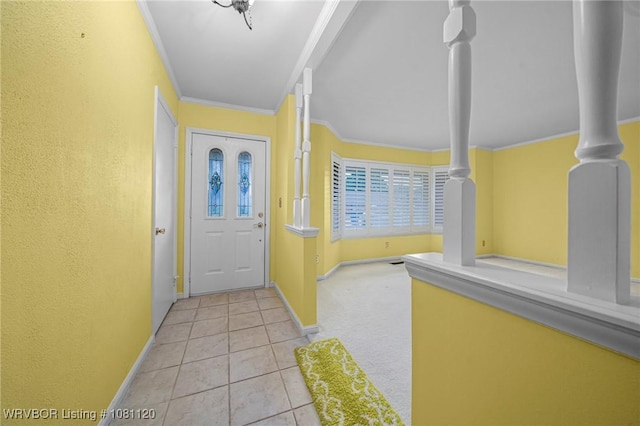 2017 S 70th St, Fort Smith, AR 72903 - doorway featuring crown molding, baseboards, tile patterned flooring, and carpet