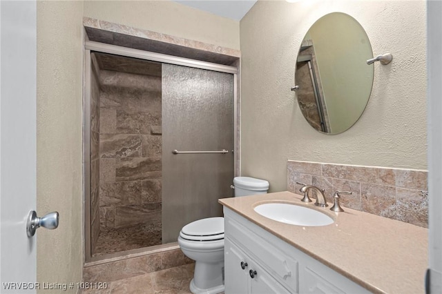 2017 S 70th St, Fort Smith, AR 72903 - bathroom with toilet, a shower stall, vanity, and a textured wall