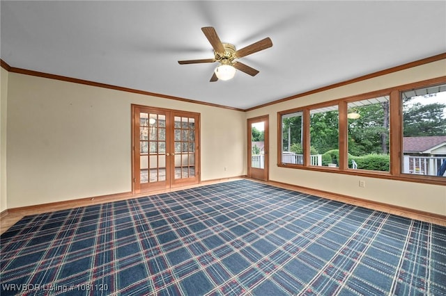 2017 S 70th St, Fort Smith, AR 72903 - spare room featuring french doors, baseboards, dark carpet, and ornamental molding